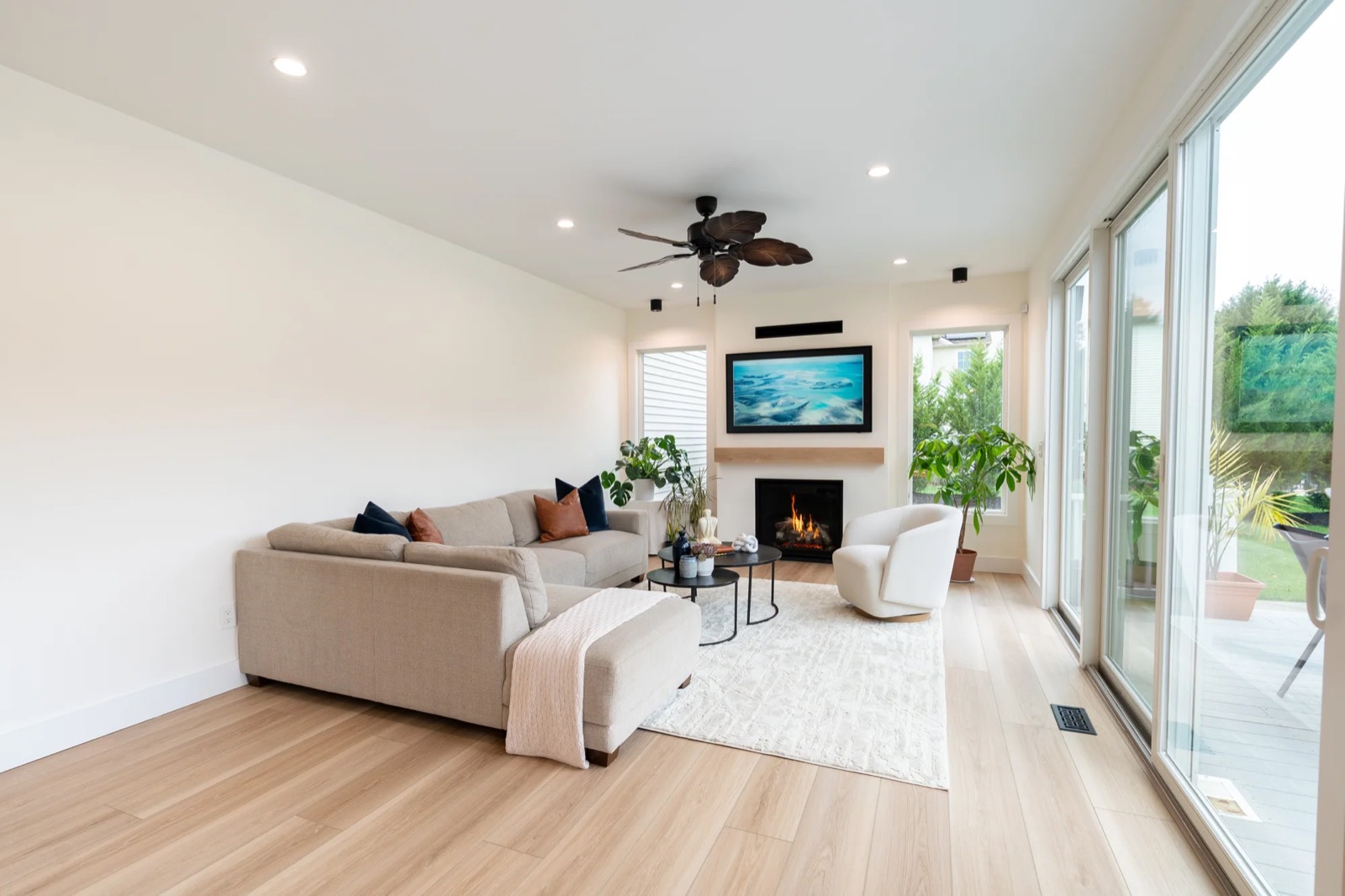 Bright living room with sliding glass doors and fireplace