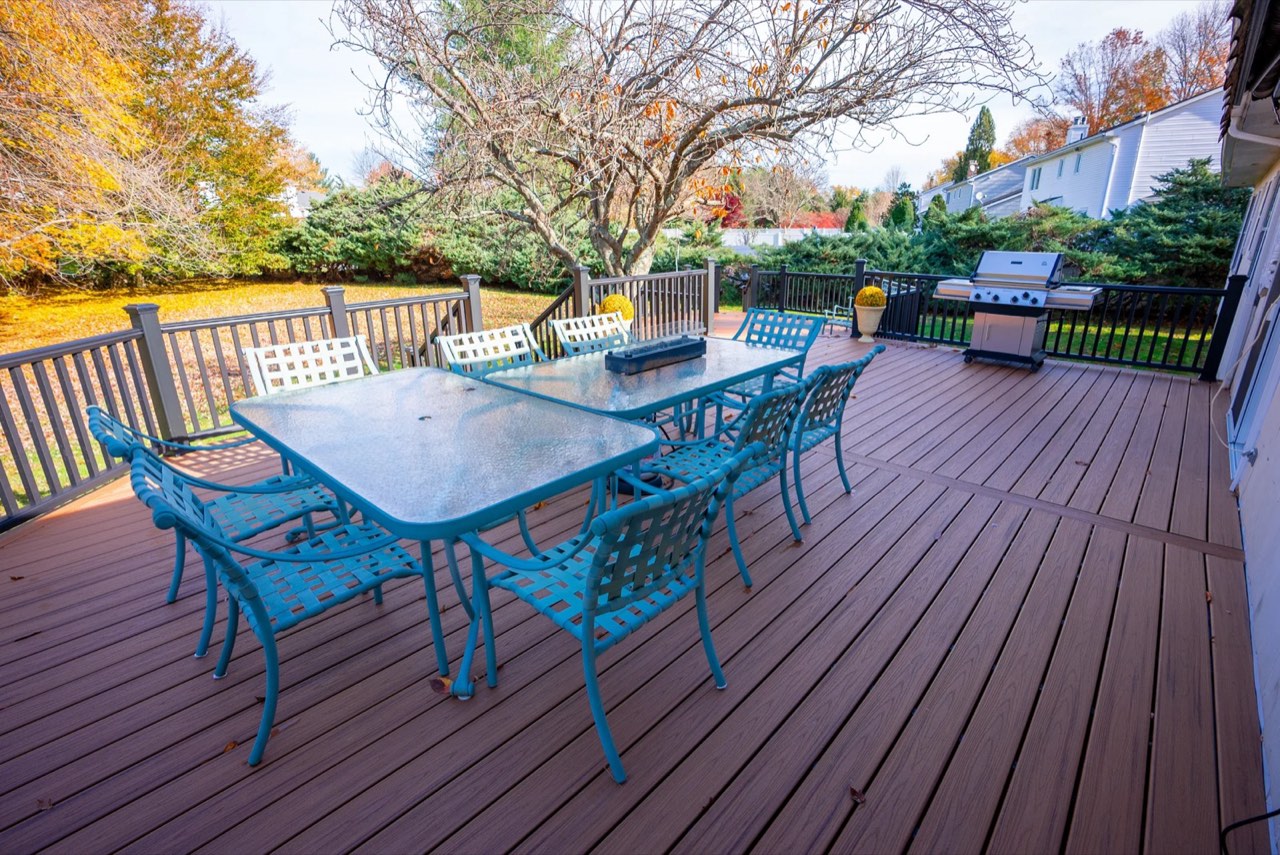 Composite deck with outdoor dining set in autumn