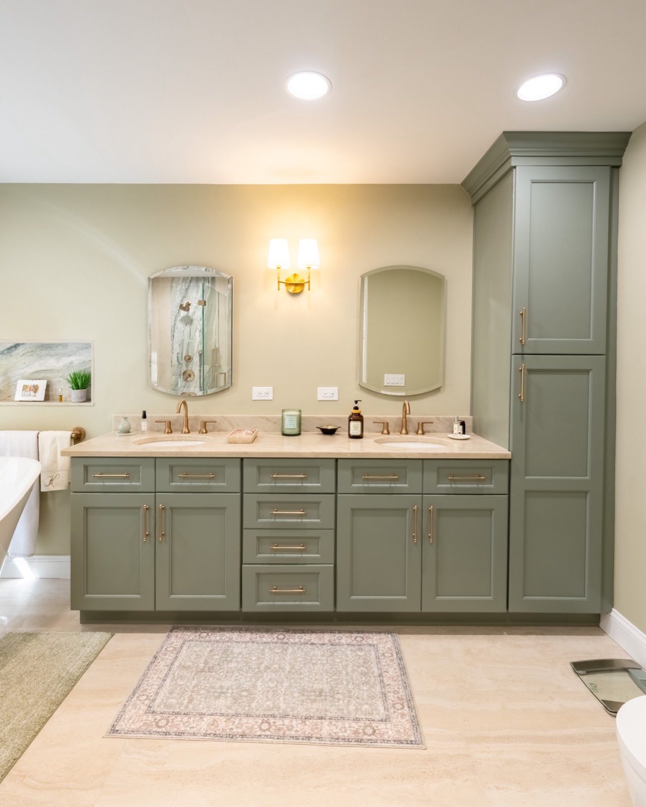 Sage double vanity with brass faucets and arched mirrors