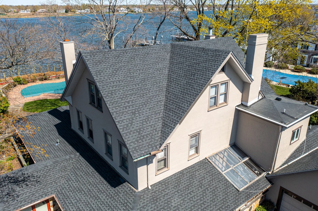 Aerial view of a newly roofed waterfront home in Oceanport